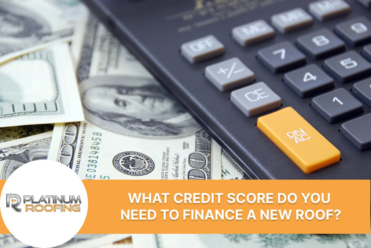 Calculator on hundred-dollar bills with text on financing new roofing